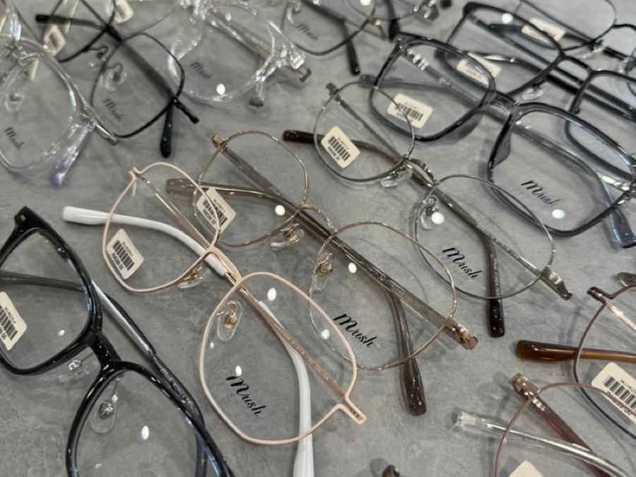 Prescription eyeglasses on display at Moment Optical